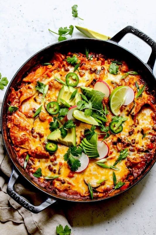 <p>Two Peas and Their Pod</p><p>Skillet vegetarian enchiladas are made in one pan and there is no rolling involved. This easy enchilada recipe only takes 30 minutes to make from start to finish and it is a family favorite dinner!</p><p><strong>Get the recipe: <a href="https://www.twopeasandtheirpod.com/skillet-vegetarian-enchiladas/" rel="nofollow noopener" target="_blank" data-ylk="slk:Skillet Vegetarian Enchiladas;elm:context_link;itc:0;sec:content-canvas" class="link rapid-noclick-resp">Skillet Vegetarian Enchiladas</a></strong></p>