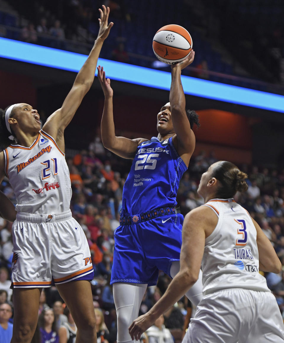 Connecticut Sun forward Alyssa Thomas (25) shoots next to Phoenix Mercury forward Brianna Turner (21) during a WNBA basketball game Tuesday, Aug. 2, 2022, in Uncasville, Conn. (Sean D. Elliot/The Day via AP)