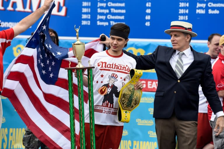 Mike Stonie takes first place after eating 62 hot dogs at The Nathan's Famous Fourth of July International Hot Dog-Eating Contest in Coney Island, New York, on July 4, 2015