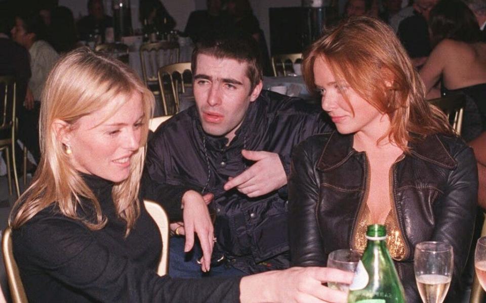 Patsy Kensit, Liam Gallagher and Stella McCartney at a War Child charity auction in 1997 - PA