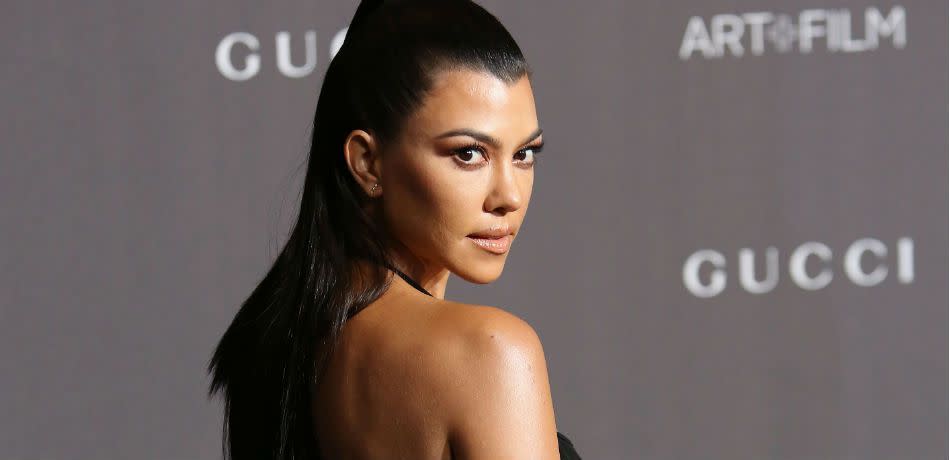 Kourtney Kardashian Does A Terrible Job Hiding Younes Bendjima In Seemingly-Naked New Year's Pic With Son Reign