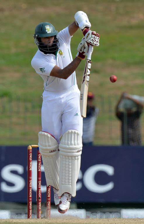 Hashim Amla plays a shot during the second day of the second Test between Sri Lanka and South Africa in Colombo on July 25, 2014