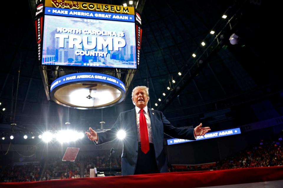 Former President Donald Trump turns and greets supporters behind the podium at Bojangles Coliseum in Charlotte, NC on Wednesday, July 24, 2024.