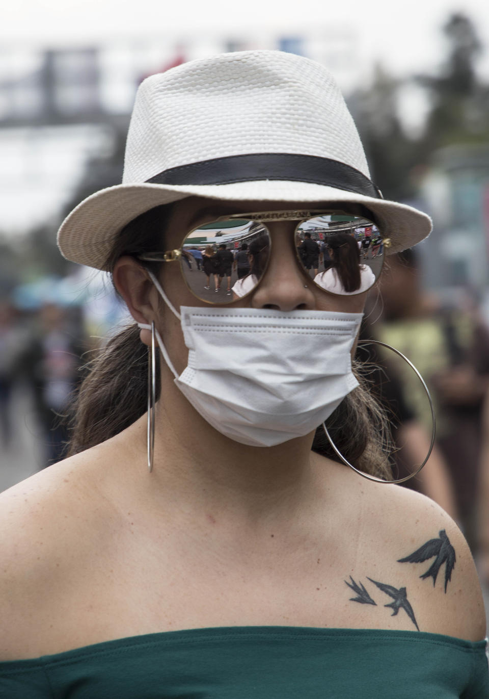 A spectator attends the Vive Latino music festival in Mexico City, Sunday, March 15, 2020. The two-day rock festival is one of the most important and longest running of Mexico. (AP Photo/Christian Palma)