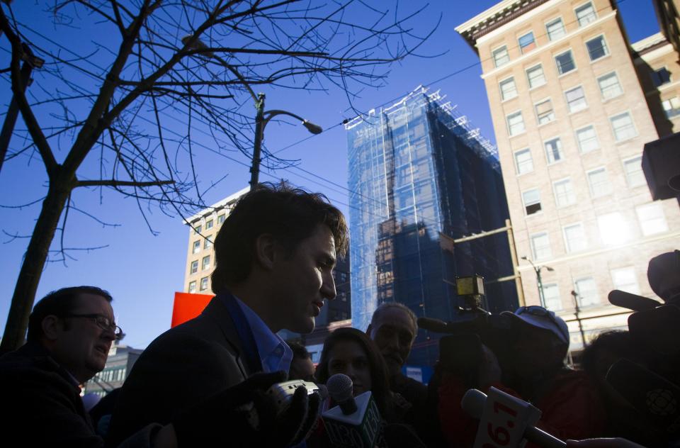 Leader of the Liberal Party of Canada MP Justin Trudeau talks to media in the downtown eastside neighbourhood in Vancouver