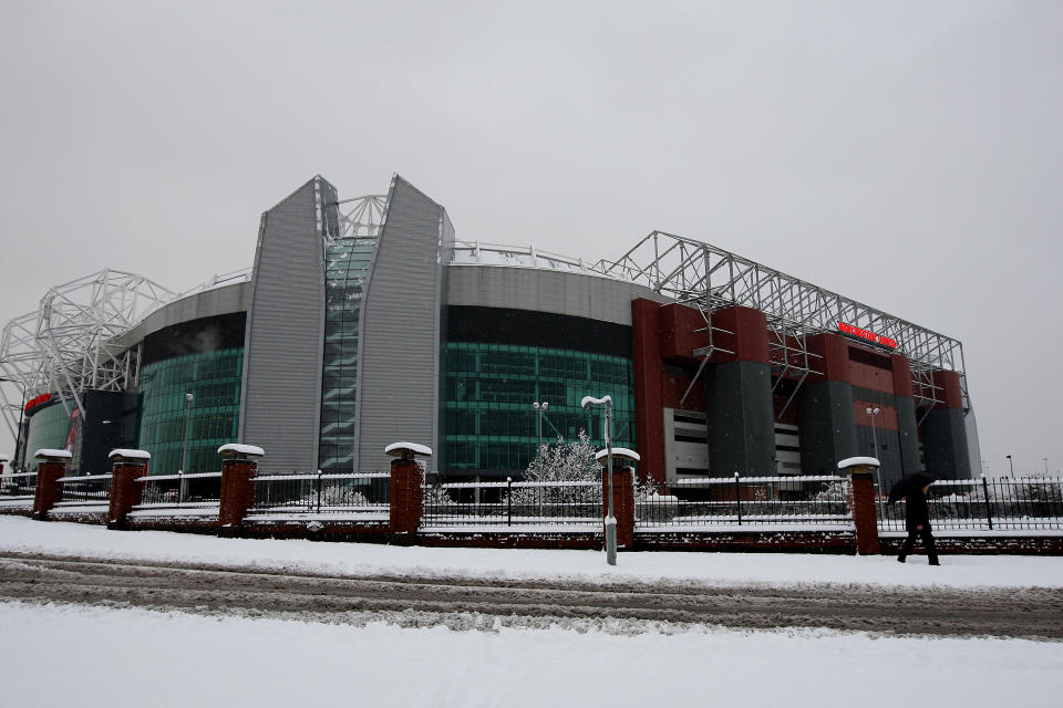 Manchester United-Manchester City is set to be played at Old Trafford Sunday afternoon, but snow is expected to cover the northwest of England. (Getty)