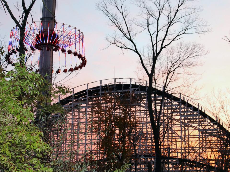 View of a rollercoaster in front of a sunset at Kings Island