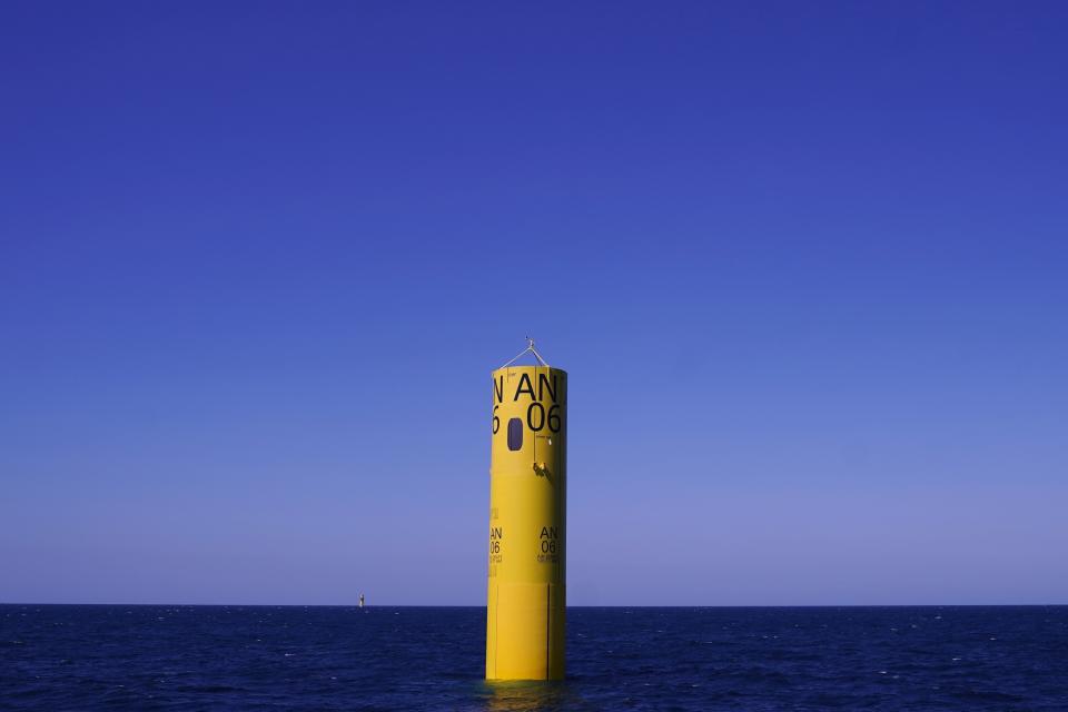 FILE - An installed monopile rises from the ocean at the South Fork Wind project, awaiting tower, turbine and blade sections, July 11, 2023, off the coast of Rhode Island. This is part of one of the first U.S. commercial-scale offshore wind farms currently under construction. (AP Photo/Charles Krupa, File)