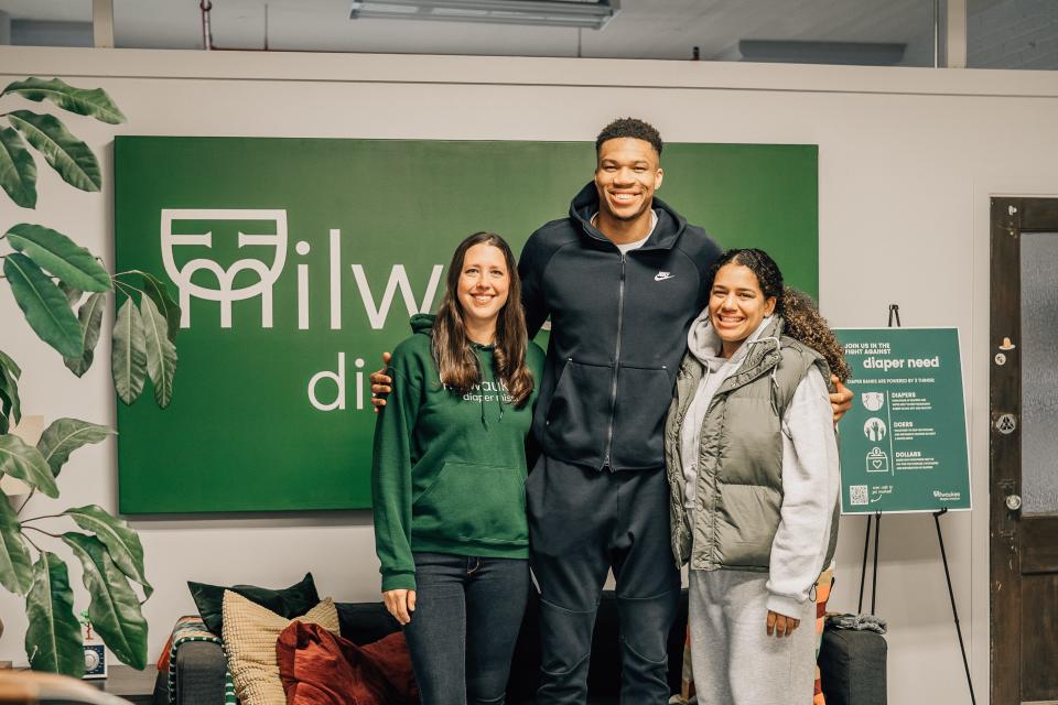 A photo of Meagan Johnson, co-founder of the Milwaukee Diaper Mission, with Giannis Antetokounmpo and Mariah Riddlesprigger at the organization's former Bay View facility. Now, the organization is located in a 5,000-square-foot warehouse in Franklin.