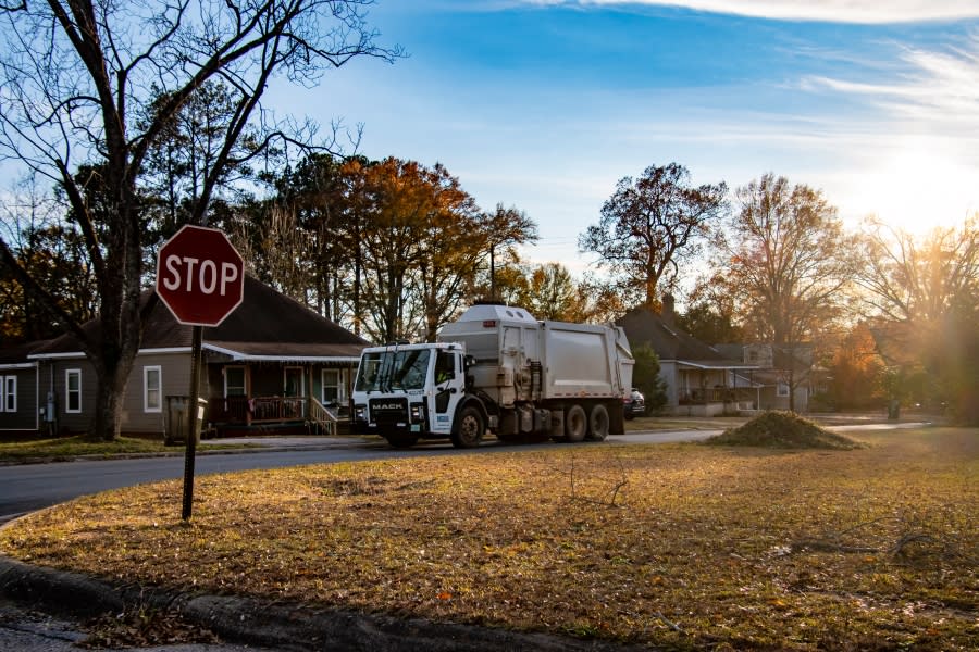 A garbage truck picks up trash in Valley, Alabama. (Photo by Lee Hedgepeth)