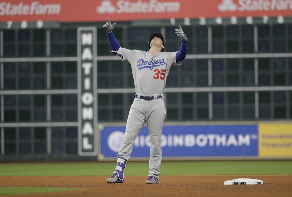 Cody Bellinger reacts after hitting a double during the seventh inning of Game 4 of the World Series. (AP)