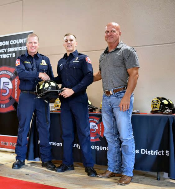 PHOTO: Jake Owen, center, is pictured alongside his dad, Craig Owen, far right, at his promotion ceremony in 2022. (Jarrell Fire Department)