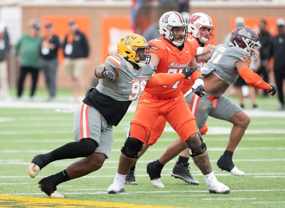 Former LSU and Navarre High School DL Jordan Jefferson (99) tries to get past National Team offensive line during the Reese's Senior Bowl in Mobile, Alabama on Saturday, Feb. 3, 2024.