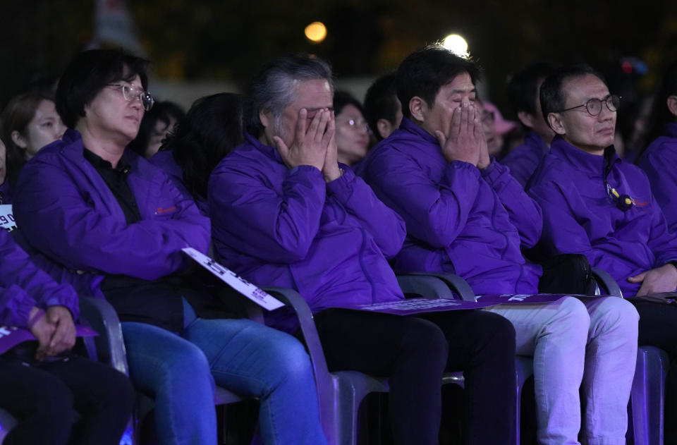 Family members of victims react during a rally marking the first anniversary of the harrowing crowd surge that killed about 160 people in a Seoul alleyway, at the Seoul Plaza in Seoul, South Korea, Sunday, Oct. 29, 2023. (AP Photo/Ahn Young-joon)