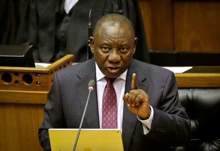 FILE PHOTO: South African President Cyril Ramaphosa speaks in parliament in Cape Town, South Africa, February 20, 2018. REUTERS/Sumaya Hisham/File Photo