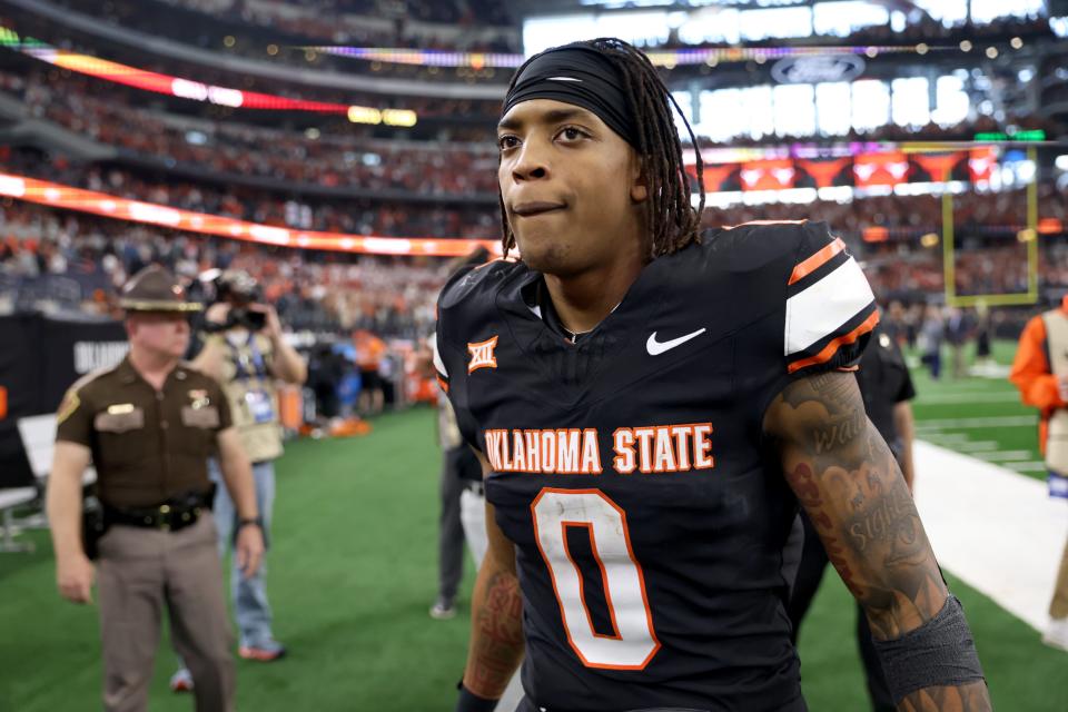 Oklahoma State’s Ollie Gordon II (0) walks of the field following the Big 12 Football Championship game between the Oklahoma State University Cowboys and the Texas Longhorns at the AT&T Stadium in Arlington, Texas, Saturday, Dec. 2, 2023. Credit: SARAH PHIPPS/THE OKLAHOMAN-USA TODAY NETWORK