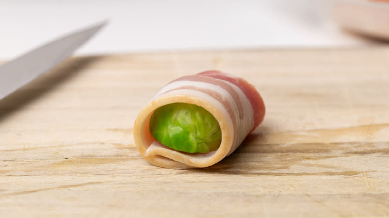 Brussels sprout half wrapped in bacon