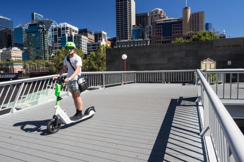 E-scooter rider on bridge