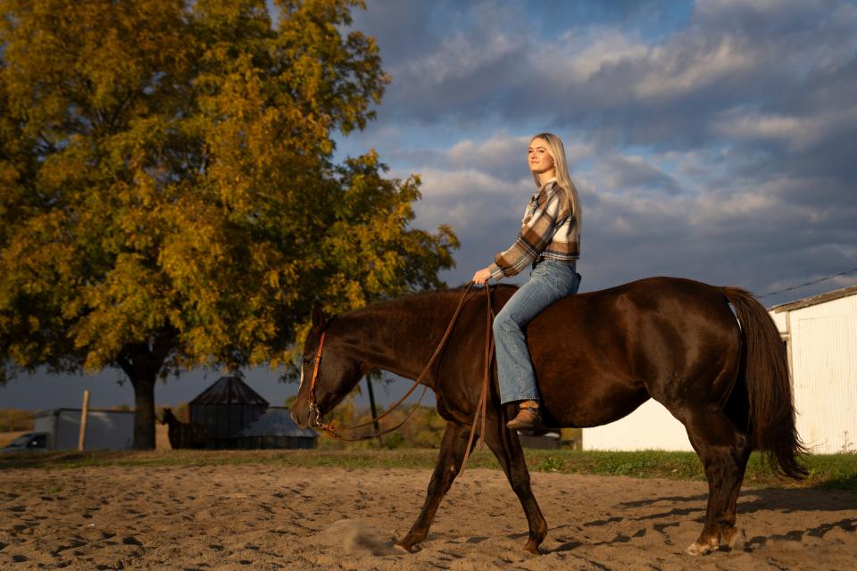Elivia Papcun rides her horse, Chicken.