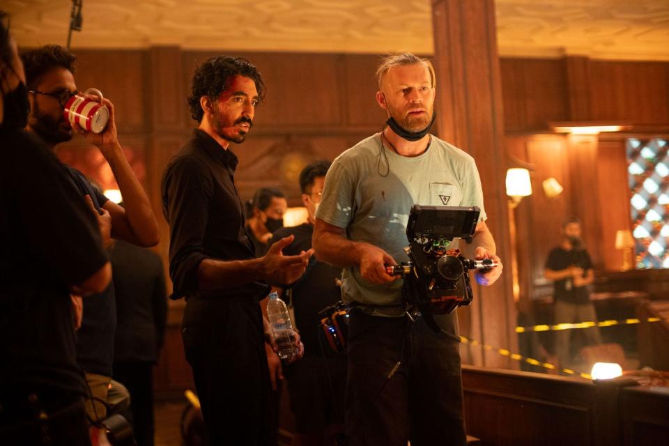 director dev patel center left on the set of his film monkey man