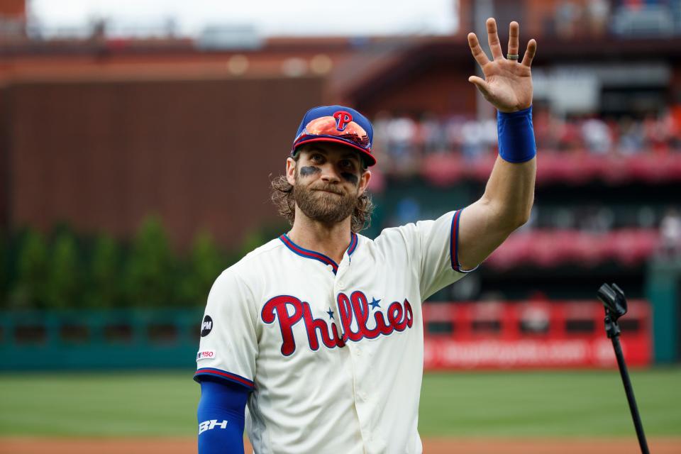 The Philadelphia Phillies' cream uniforms, worn here by Bryce Harper, have not arrived yet for the 2022 season.