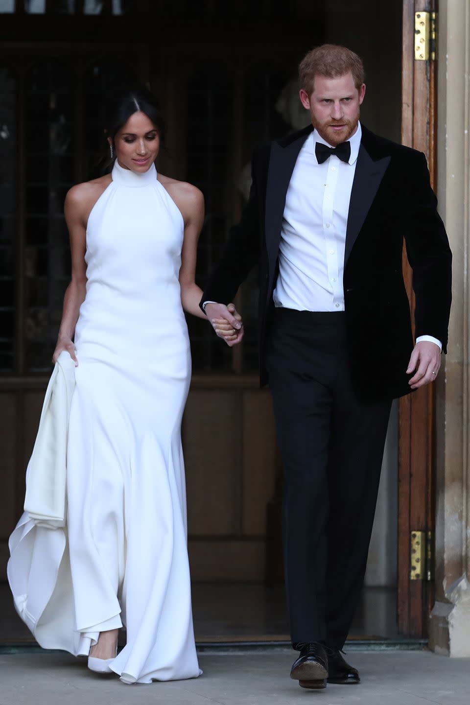 <p>Again, when you're royalty, you get two wedding dresses. Meghan changed into a sexy halter-neck Stella McCartney white dress for her wedding reception at Frogmore House.</p><p><strong>RELATED</strong>: <a href="https://www.goodhousekeeping.com/life/a34407473/the-queen-shut-down-prince-harry-meghan-markle-wedding-day-tiara/" rel="nofollow noopener" target="_blank" data-ylk="slk:The Queen Reportedly Shut Down Prince Harry's Demand That Meghan Markle Get Her Way on Her Wedding Day;elm:context_link;itc:0;sec:content-canvas" class="link ">The Queen Reportedly Shut Down Prince Harry's Demand That Meghan Markle Get Her Way on Her Wedding Day</a></p>