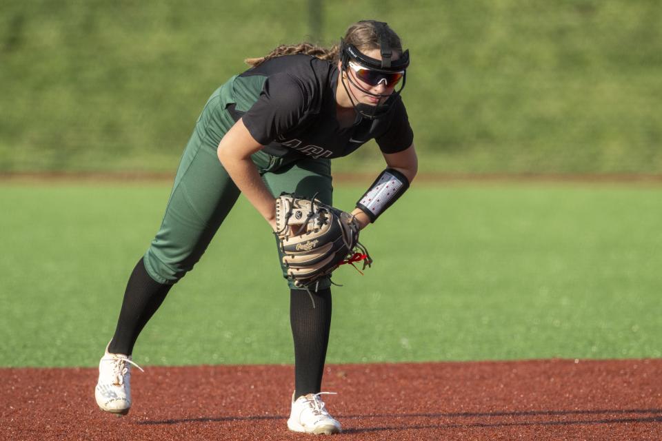 Zionsville High School freshman Tess Bradford (15) readies in the infield during an IHSAA softball game against New Palestine High School, Friday, April 19, 2024, at New Palestine High School. New Palestine won, 6-1.