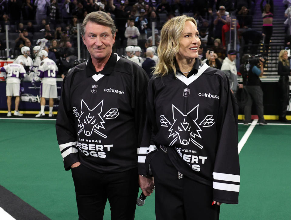 LAS VEGAS, NEVADA - DECEMBER 16: Co-owner Wayne Gretzky (L) of the Las Vegas Desert Dogs and his wife Janet Gretzky are introduced before the Desert Dogs' inaugural regular-season home opener against the Panther City Lacrosse Club at Michelob ULTRA Arena on December 16, 2022 in Las Vegas, Nevada. Panther City defeated the Desert Dogs 9-3. (Photo by Ethan Miller/Getty Images for National Lacrosse League)