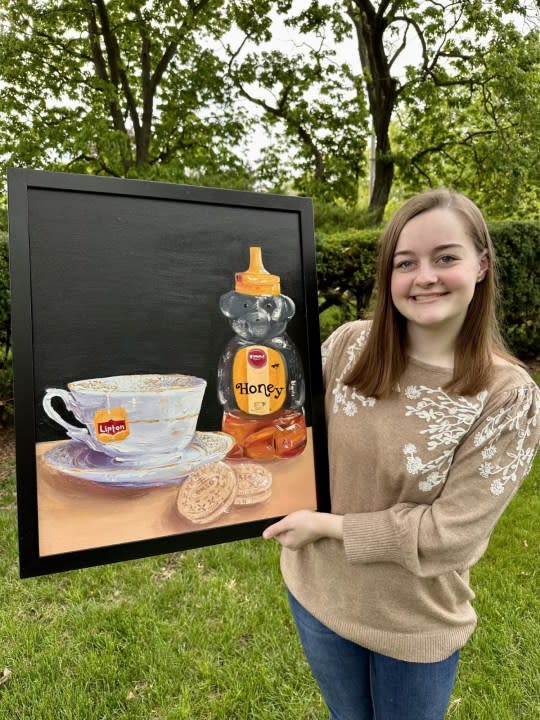 The 2023 Congressional Art Competition winner for Illinois’ 17th District, Emmelia Edwards of Peoria, holds her winning submission, Grandma’s House. (Rep. Sorensen’s Office)