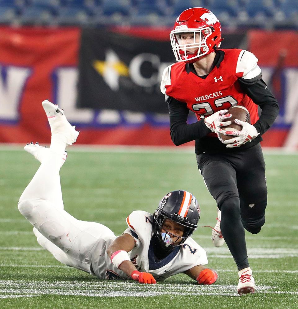Wildcat Harrison Hinckle takes an interception to the house leaving a Walpole receiver Jamal Abdal-Khallaq in his wake. Milton and Walpole faced off in the MIAA Div. 3 Super Bowl at Gillette Stadium on Thursday, Nov. 30, 2023.