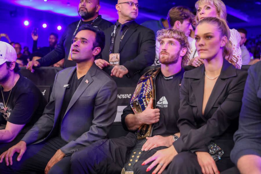 ORLANDO, FL – DECEMBER 15: Vivek Ramaswamy watches with Logan Paul and Nina Agdal as Jake Paul and Andre August fight during the Jake Paul v Andre August at the Caribe Royale Orlando on December 15 2023 in Orlando, Florida. (Photo by Alex Menendez/Getty Images)