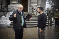 In this photo provided by the Ukrainian Presidential Press Office, Ukrainian President Volodymyr Zelenskyy, right, and former British Prime Minister Boris Johnson talk during their meeting in Kyiv, Ukraine, Sunday, Jan. 22, 2023. (Ukrainian Presidential Press Office via AP)