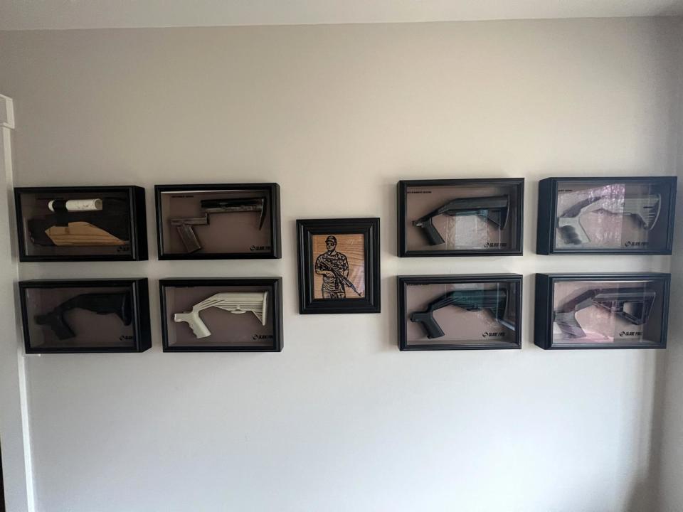 PHOTO: Prototypes for the bump stock, which were government approved for sale in 2010 and protected by federal patents, hang on the wall of Jeremiah Cottle's Knoxville, Tenn., home.  (ABC News)