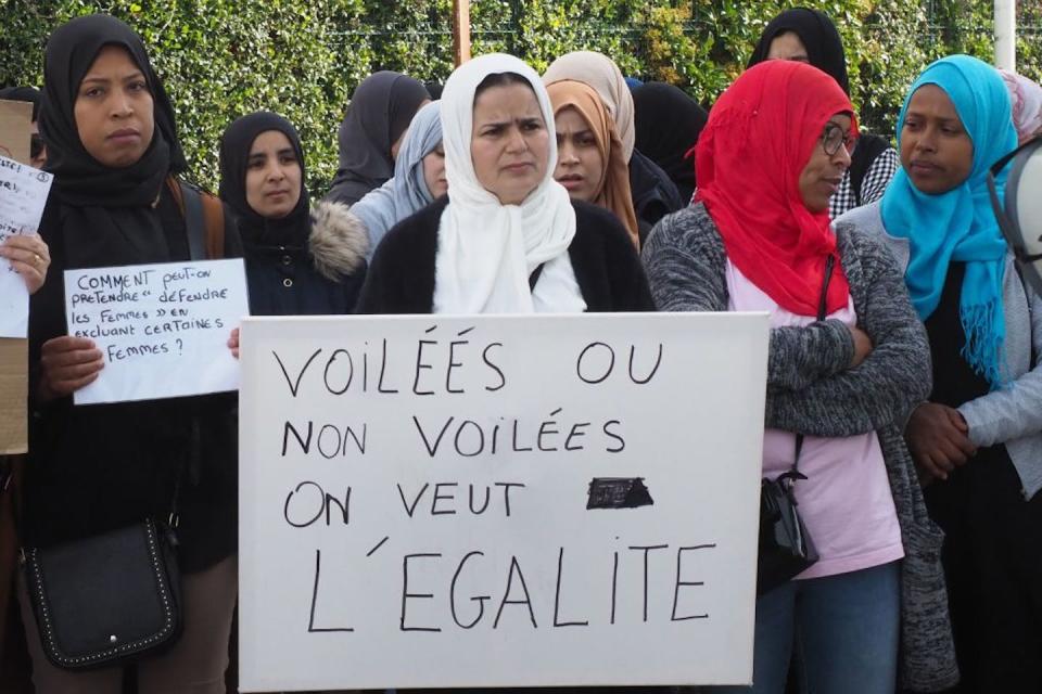 ‘Veiled or not veiled, we want equality’: Parents and supporters protest in 2019 against a proposal to ban mothers who wear headscarves from school trips. <a href="https://www.gettyimages.com/detail/news-photo/parents-and-members-of-le-collectif-66-des-mamans-en-colere-news-photo/1146681939?adppopup=true" rel="nofollow noopener" target="_blank" data-ylk="slk:Raymond Roig/AFP via Getty Images;elm:context_link;itc:0;sec:content-canvas" class="link ">Raymond Roig/AFP via Getty Images</a>
