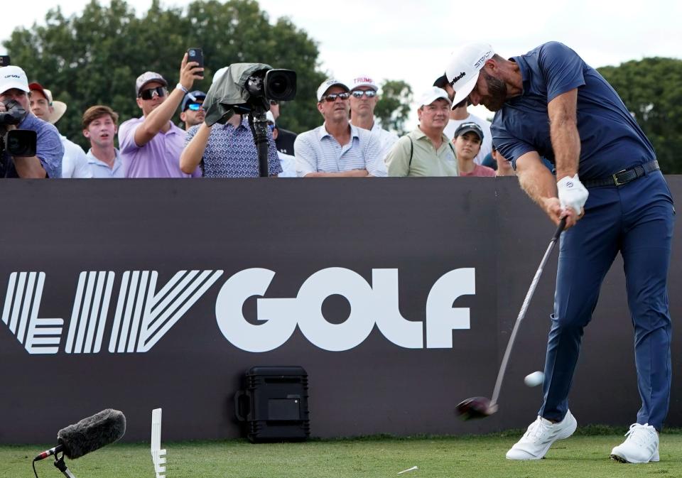 FILE - Dustin Johnson hits from the third tee during the second round of the LIV Golf Team Championship at Trump National Doral Golf Club, Oct. 29, 2022, in Doral, Fla. The second year of Saudi-funded LIV Golf will be going to three courses owned by former President Donald Trump as part of a 14-event schedule in 2023, according to a report from SI.com. (AP Photo/Lynne Sladky, File)