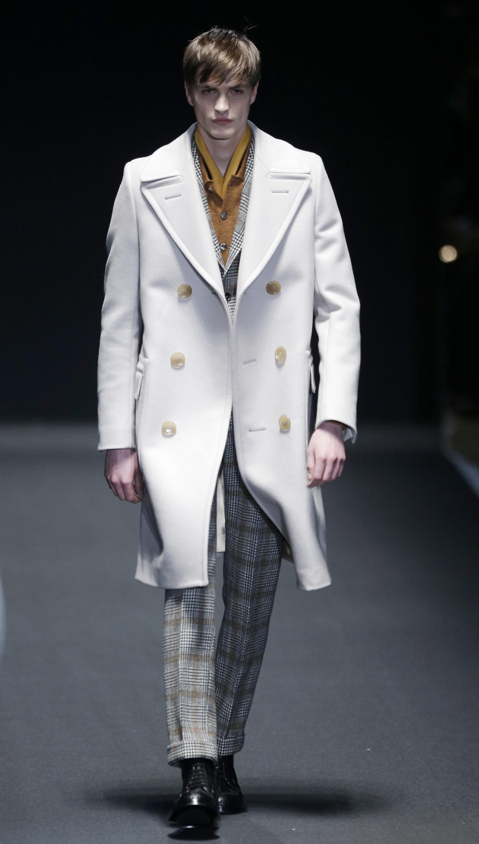 A model wears a creation for Gucci men's Fall-Winter 2013-14 collection, part of the Milan Fashion Week, unveiled in Milan, Italy, Monday, Jan. 14, 2013. (AP Photo/Antonio Calanni)