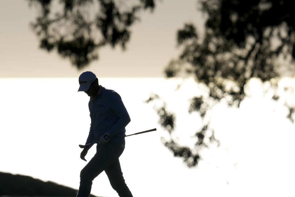 Maverick McNealy walks onto the green on the eighth hole of the South Course at Torrey Pines during the second round of the Farmers Insurance Open golf tournament, Thursday, Jan. 26, 2023, in San Diego. (AP Photo/Gregory Bull)