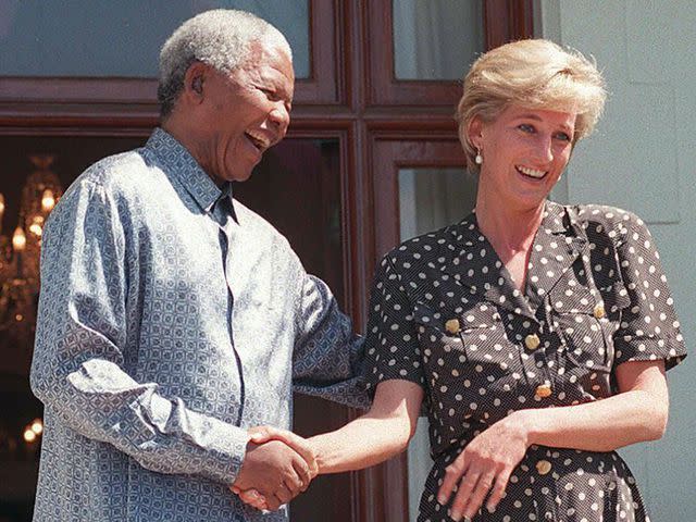 <p>ANNA ZIEMINSKI/AFP via Getty</p> Nelson Mandela and Princess Diana speak with the press after meeting in the Mandela's home in Cape Town, South Africa.