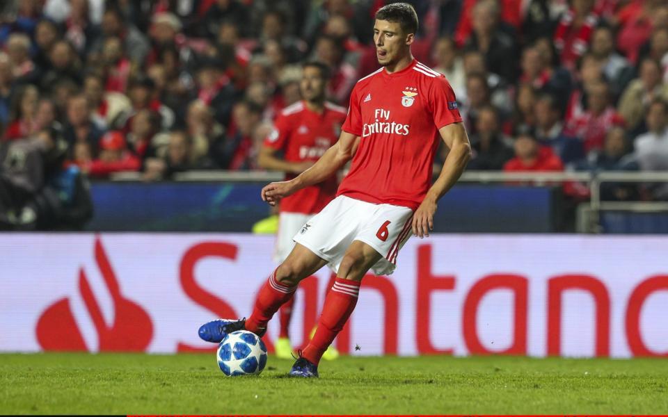 Ruben Dias of SL Benfica kicks the ball during the Group E match of the UEFA Champions League between SL Benfica and Ajax - Getty Images