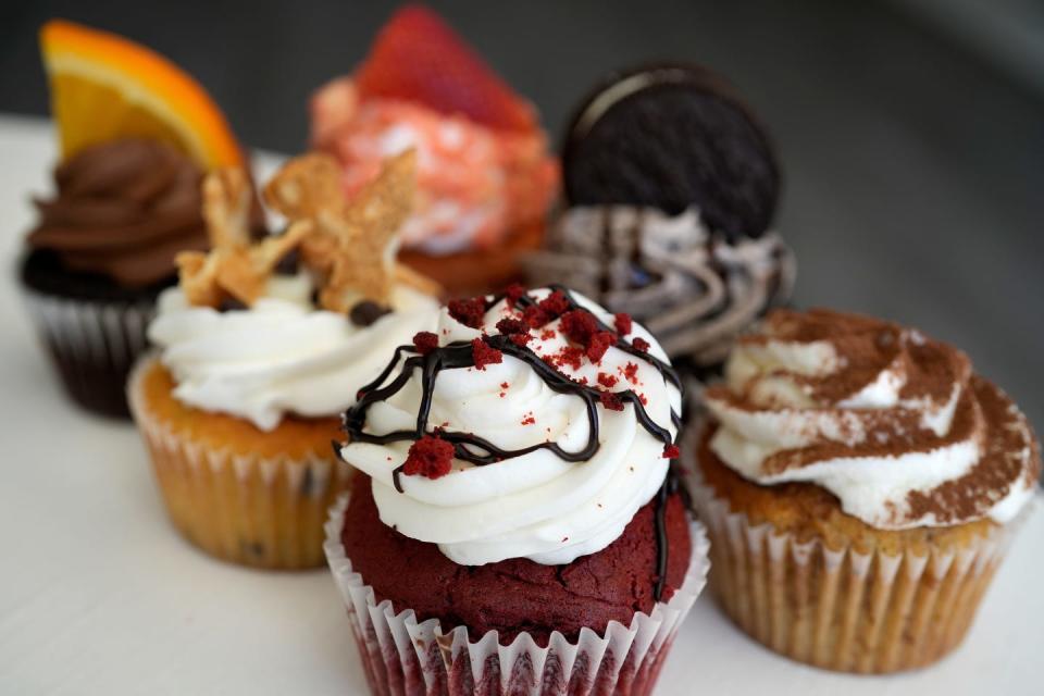 Front to back clockwise Red Velvet, Cannoli, Chocolate Orange Basil, Strawberry Crunch, Oreo Cookie and Tiramisu cupcakes from the Nerdy Baker in Rumford.