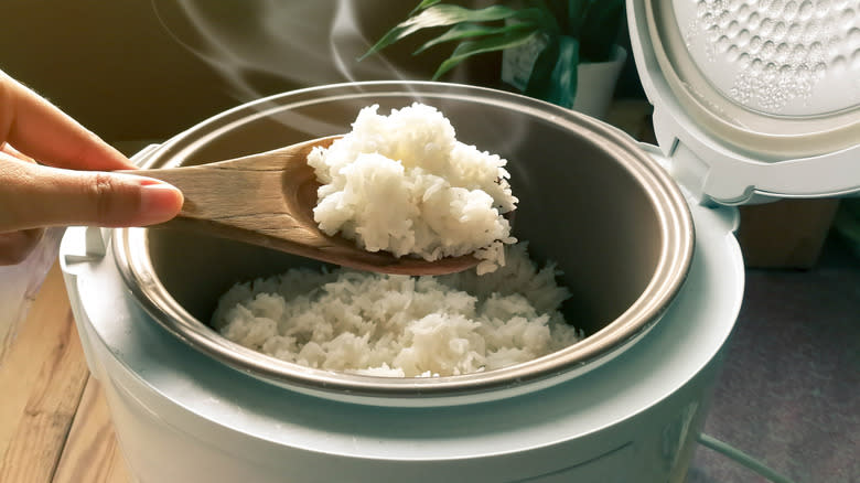 Wooden spoon in rice cooker