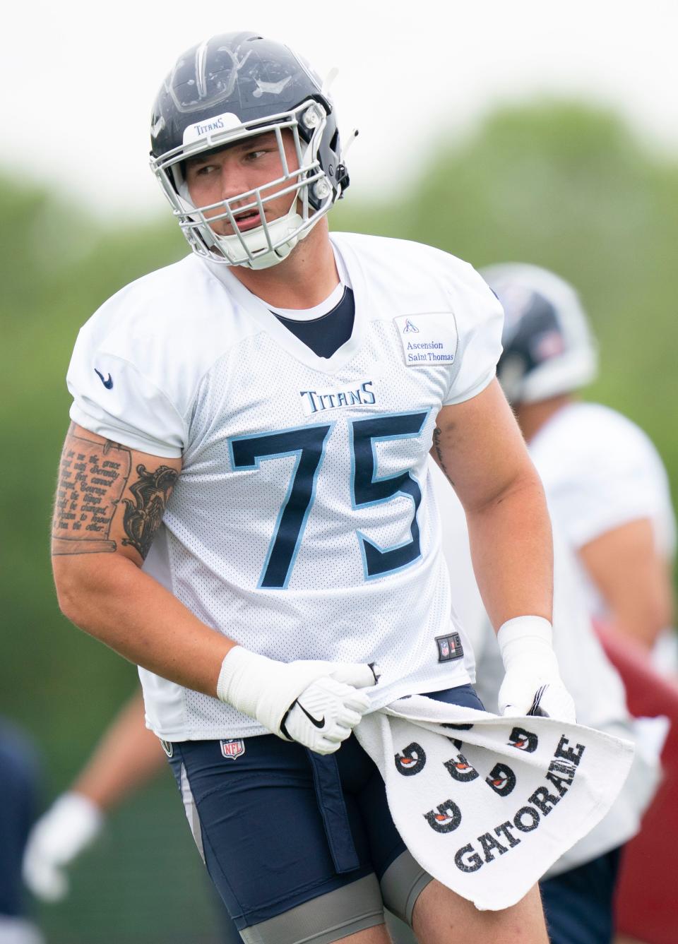 Tennessee Titans offensive lineman Dillon Radunz (75) heads to the huddle during practice at Saint Thomas Sports Park Tuesday, May 24, 2022, in Nashville, Tenn. 