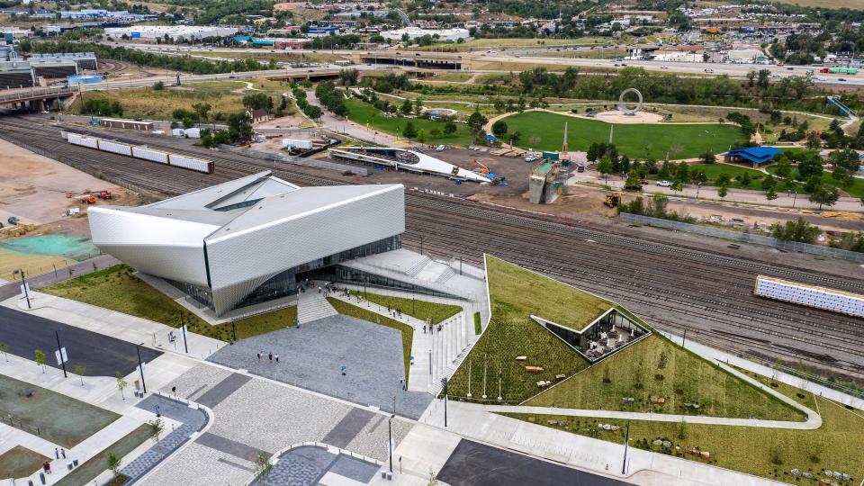 The new U.S. Olympic and Paralympic Museum is split into two structures on a slightly elevated campus—the museum and a building containing a cafe, theater, and event space. A natural amphitheater and plaza separate them.