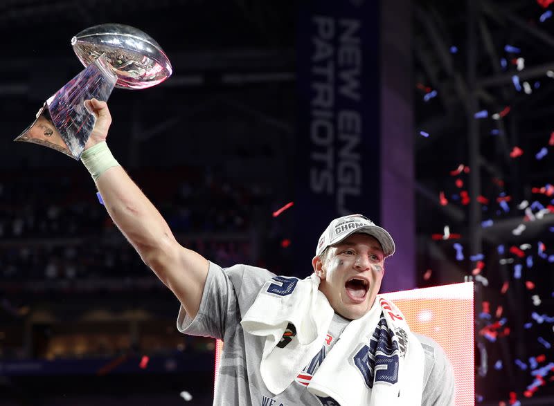 FILE PHOTO: New England Patriots tight end Rob Gronkowski holds up the Vince Lombardi Trophy after his team defeated the Seattle Seahawks in the NFL Super Bowl XLIX football game in Glendale