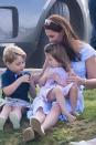 <p>Not afraid to get down and dirty, the Duchess sits on the grass with Prince George and Princess Charlotte <a href="https://www.harpersbazaar.com/celebrity/latest/a21266824/princess-charlotte-makes-kate-middleton-laugh/" rel="nofollow noopener" target="_blank" data-ylk="slk:while attending a polo match;elm:context_link;itc:0;sec:content-canvas" class="link ">while attending a polo match</a><span class="redactor-unlink"> at Beaufort Park</span>. </p>