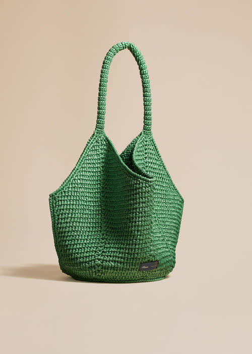 <p><a href="https://go.redirectingat.com?id=74968X1596630&url=https%3A%2F%2Fkhaite.com%2Fproducts%2Flotus-bag-medium-in-forest-green%3Fvariant%3D40181901131839&sref=https%3A%2F%2Fwww.veranda.com%2Fshopping%2Fg60568269%2Fbest-designer-beach-bags%2F" rel="nofollow noopener" target="_blank" data-ylk="slk:Shop Now;elm:context_link;itc:0;sec:content-canvas" class="link rapid-noclick-resp">Shop Now</a></p><p>Medium Lotus Tote</p><p>khaite.com</p><p>$1650.00</p>