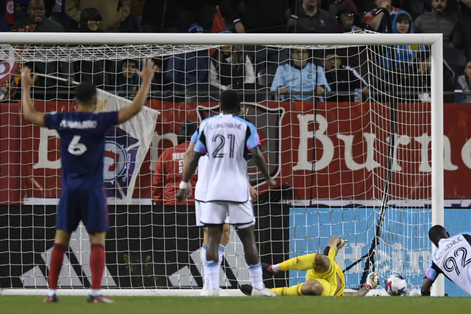 Minnesota United goalie Dayne St. Clair (97) misses a goal by Chicago Fire forward Kei Kamara (23) during the first half of an MLS soccer game Saturday, April 8, 2023 in Chicago. Chicago won 2-1. (AP Photo/Paul Beaty)