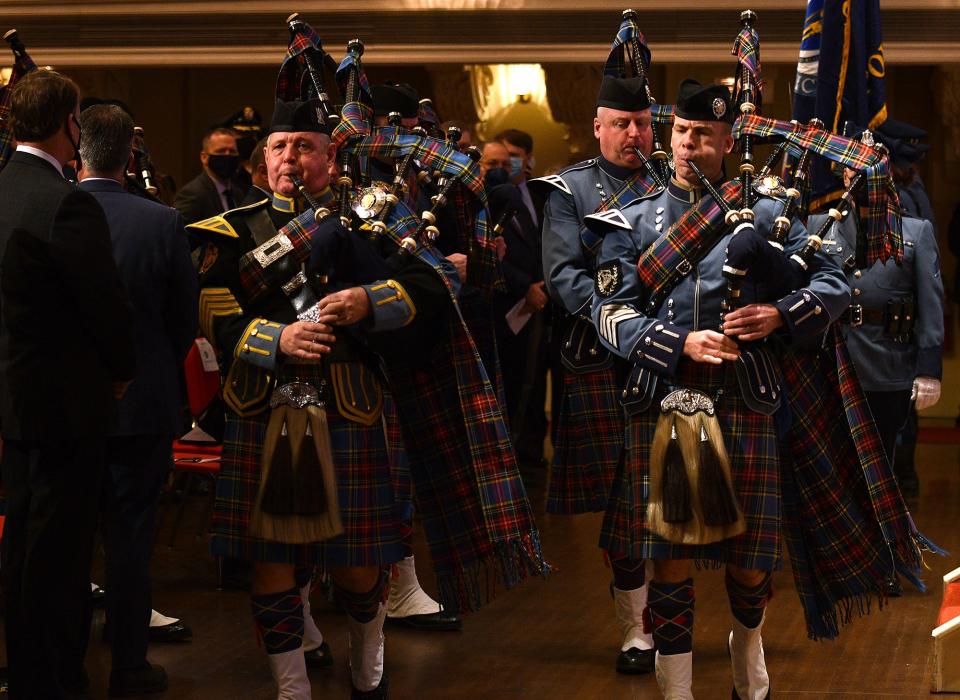 The Massachusetts State Police Pipes and Drums play for the procession at Mechanics Hall.