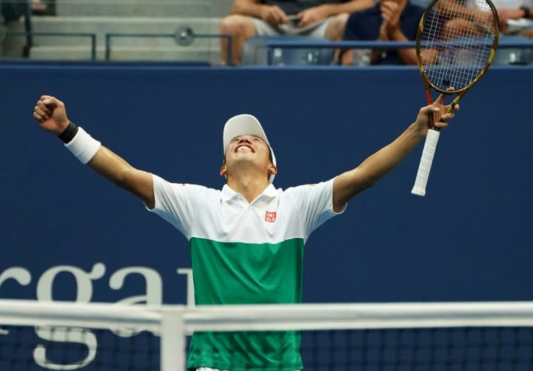 At last: Kei Nishikori celebrates his five-set victory over Marin Cilic in the quarter-finals of the US Open