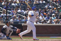 New York Mets' Daniel Vogelbach follows through after hitting an an RBI-single in the first inning of game one of a double header baseball game against the Atlanta Braves, Saturday, Aug. 6, 2022, in New York. (AP Photo/Mary Altaffer)